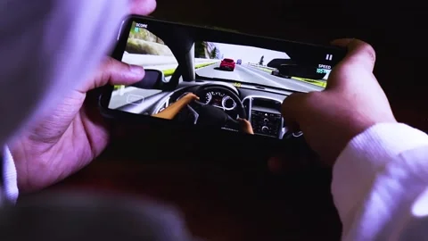 A Man Playing a Mobile Game With a Smartphone. Video stock 170660608