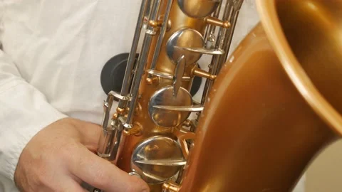 A Man Playing An Old Saxophone Stock Footage 153370068