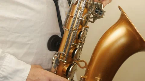 A Man Playing An Old Saxophone Stock Footage 153370073