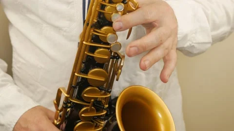 A Man Playing An Old Saxophone Stock Footage 153370075