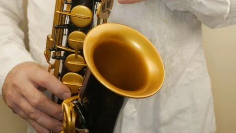 A Man Playing An Old Saxophone Stock Footage 153370079