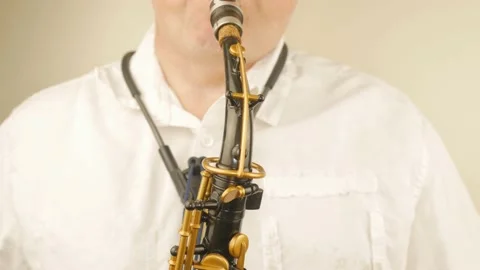 A Man Playing An Old Saxophone Stock Footage 153370080