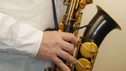 A Man Playing An Old Saxophone Stock Footage 153370081