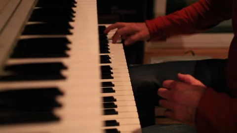 Man playing piano effusively 스톡 동영상 290940582