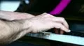 A man playing on piano HD Footage