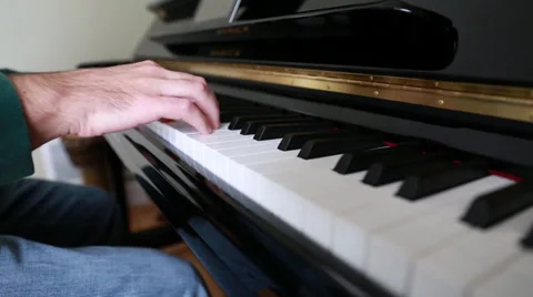 A man playing the piano Stock Footage 32821081