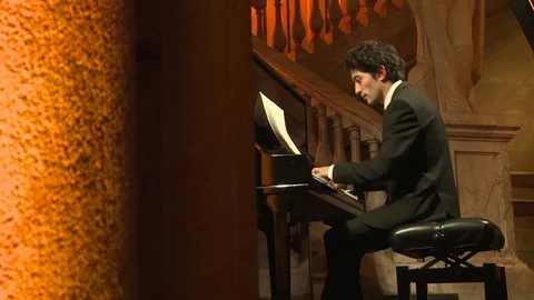 Man playing piano Stock Footage 73896498