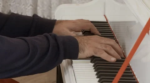 A man playing the piano. hands closeup Stock Footage 67454445