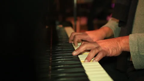 Man playing piano inside building 스톡 동영상 293007474