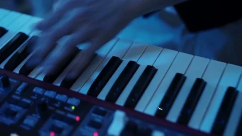 Man playing piano keyboard Stock Footage 77227439