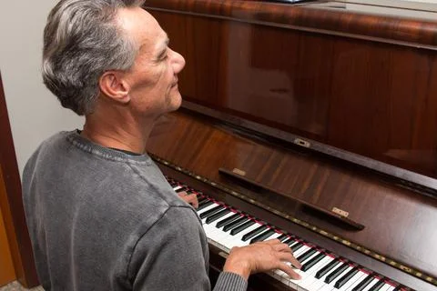 Man Playing Piano Stock Photos