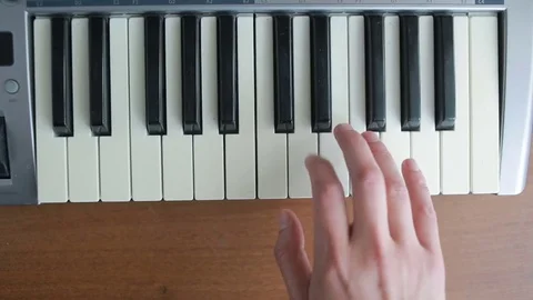 A man playing the piano. right hand Stock Footage
