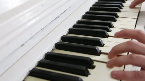 Man playing piano. Side view of a man playing piano. Close up on piano keys, man Stock Footage 103291029