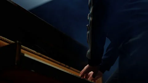 Man Playing The Piano Surrounded By Cold Vapor Smoke Video stock 236512793