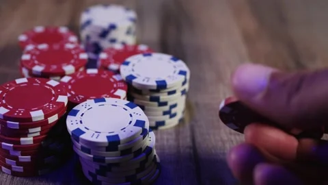 Man playing with poker chips Stock Footage 160914434
