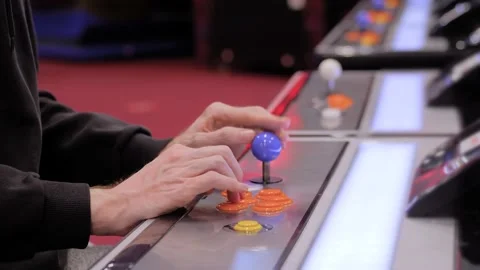 Man playing retro arcade machine game. Vintage, 80s, gaming, hobby concept Видео 196491714