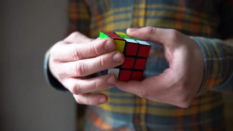 Man playing with Rubik's cube Stock Footage 159546937
