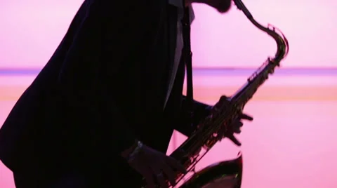 Man playing sax while making smooth dance moves Stock Footage