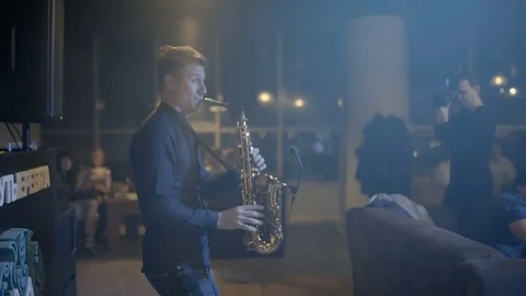 Man is playing a saxophone close-up Stock Footage 76556746