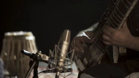 Man is playing on sitar instrument 스톡 동영상 93346309