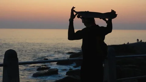 Man playing with a skateboard silhouette Stock Footage 337418441