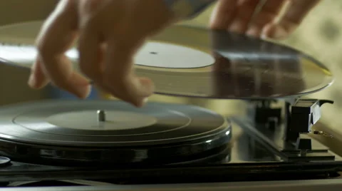 Man playing songs on a record player Stock Footage 67110268