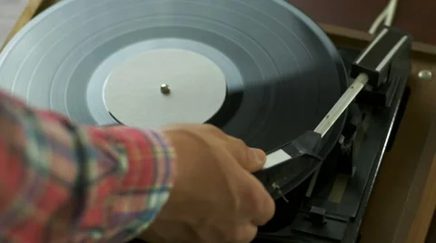 Man playing songs on a record player Stock-Footage 67114059