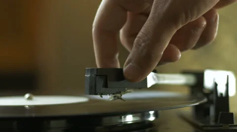 Man playing songs on a record player Stock Footage 67114820
