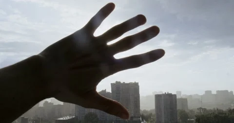 Man Playing with Sun Rays. Palm. Through Fingers Passes Rays into Camera Stock Footage 134379005