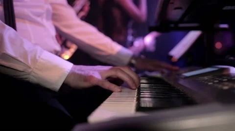 Man playing on synthesizer Stock Footage 48856536