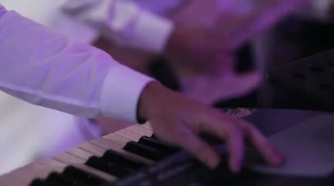 A man playing on a synthesizer Stock Footage 66062005