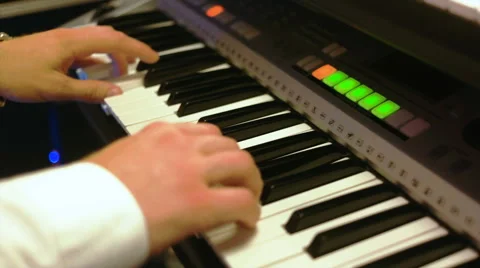 A man playing on a synthesizer Stock Footage 67642990