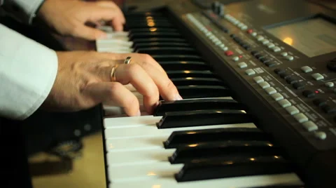 Man playing on a synthesizer Stock-Footage 68636960