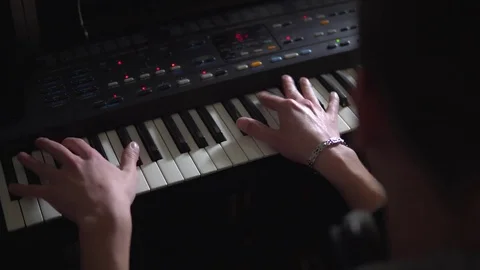 Man playing on synthesizer in Studio Stock Footage 72448361