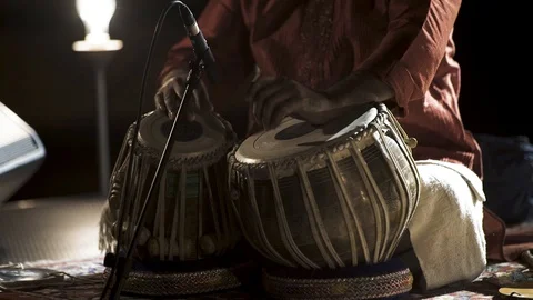 Man is playing on tabla Stock Footage 93346394