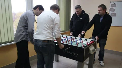 Man playing table soccer in the office Stock Footage 61145639
