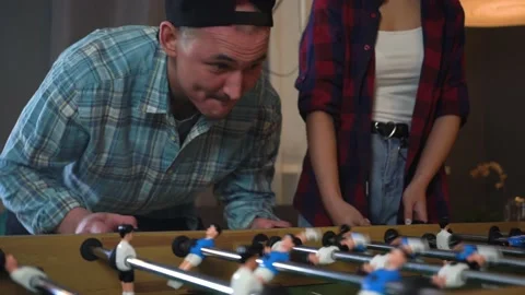 Man Playing Table Soccer In The Playroom. Nervous about Losing Hitting the table Stock Footage 150290515