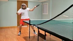 Man playing table tennis with robot auto, Stock Video