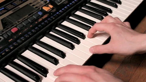 Man Playing A Tabletop Keyboard Stock Footage 37961218