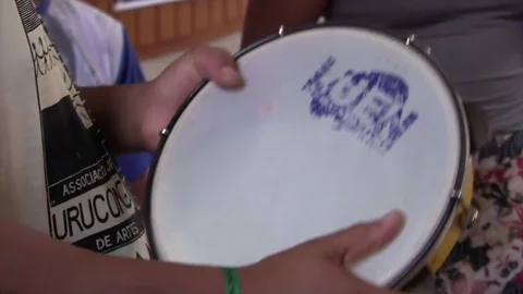 Man playing the tambourine Stock Footage 77744400