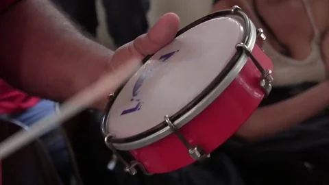 Man playing the tambourine Stock Footage 77744403