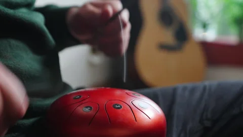 Man playing a tank HAPI drum with sticks Video stock 231802041