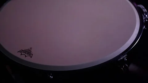 A man playing timpani in a dark room, tilt. Stock Footage 130987089