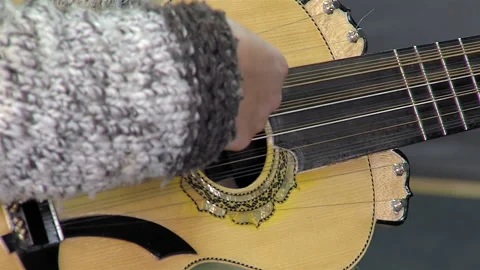 A Man Playing A Typical Chilean Stringed Instrument Called "Chilean Guitarron". Stock Footage 266305242