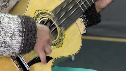 A Man Playing A Typical Chilean Stringed Instrument Called "Chilean Guitarron". Stock Footage 266305319