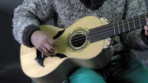 A Man Playing A Typical Chilean Stringed Instrument Called "Chilean Guitarron". Stock Footage 266305351