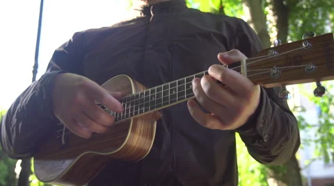 Man Playing the Ukulele Stock Footage 64747123