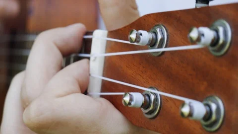 Man playing on ukulele at nature close-up hands and music instrument. 스톡 동영상 108389840