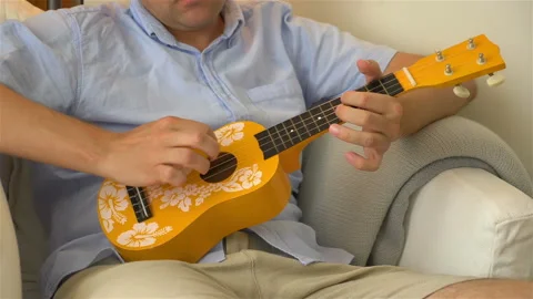 Man playing ukulele in slow motion Stock-Footage 91962447