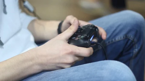 Man playing using gamepad Stock Footage 87135422